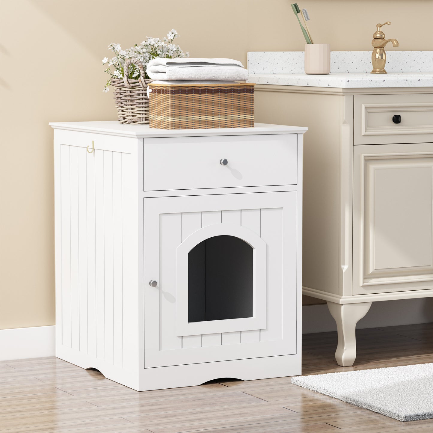 White wooden pet door cabinet with a small dog peeking out, placed against a beige wall.