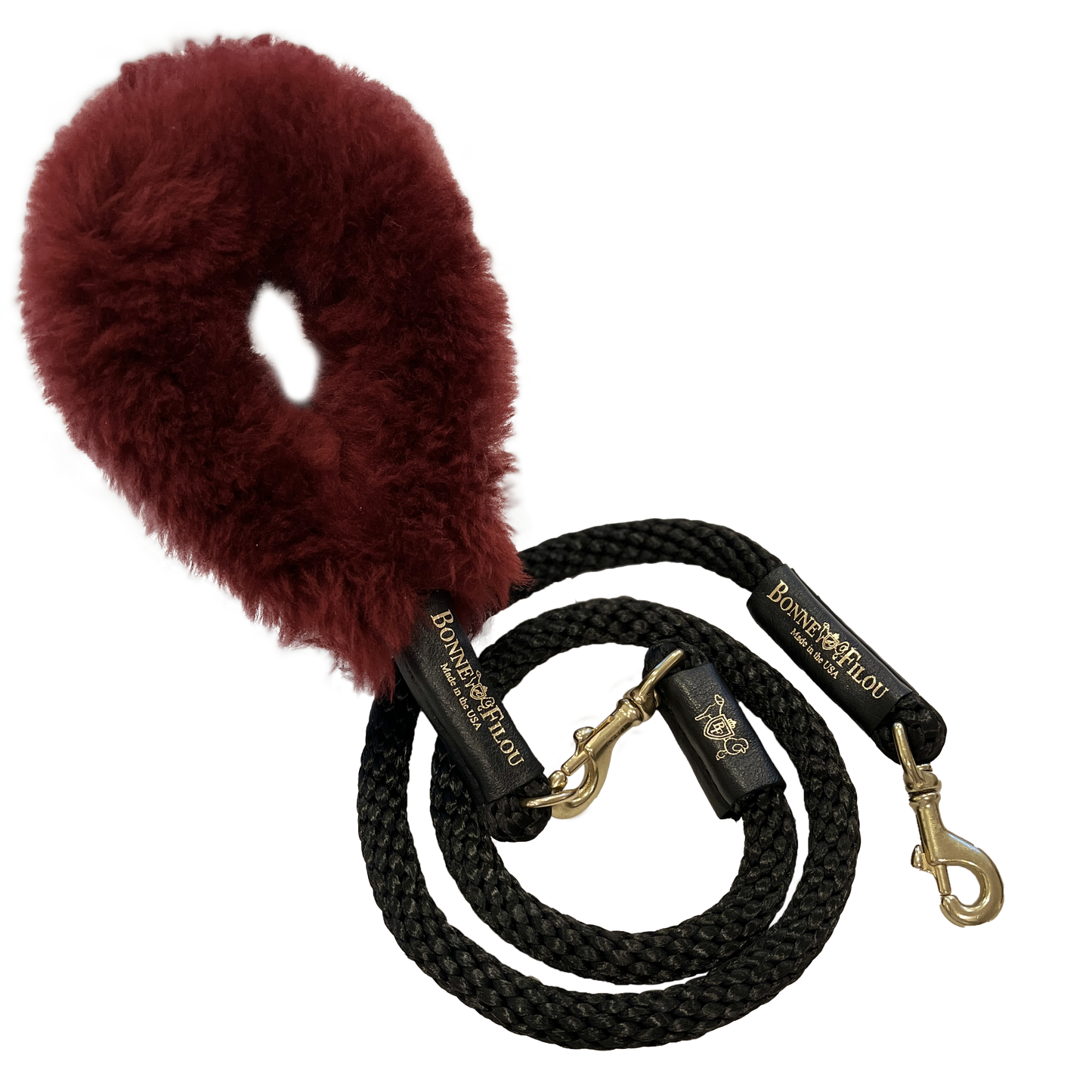 Black dog leash with a red fuzzy handle on a white background