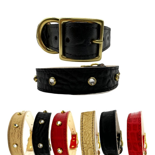 Collection of black, red, and gold leather dog collars with gold buckles on a white background.