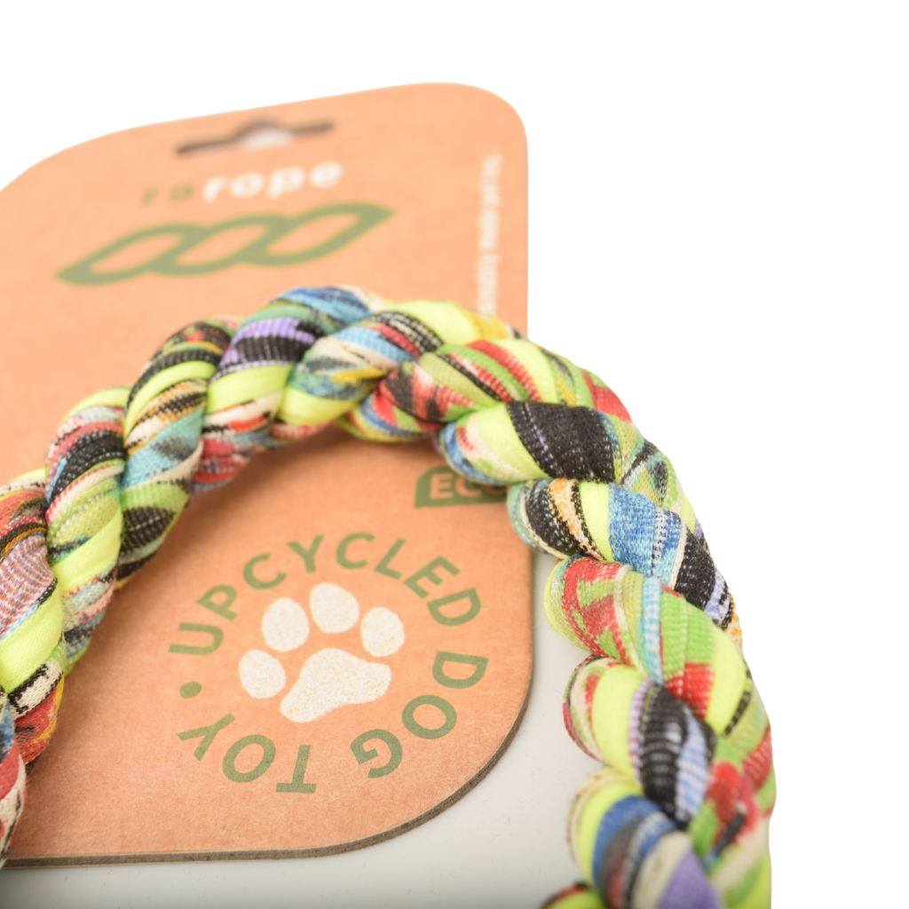 Colorful braided dog toy with 'Recycled Dog Toy' packaging on a white background