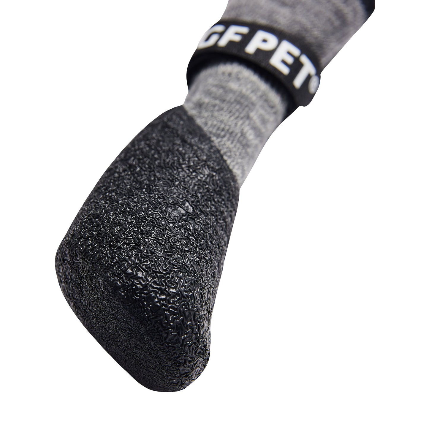 Close-up of a gray sock with textured sole and 'PET' branding on a white background