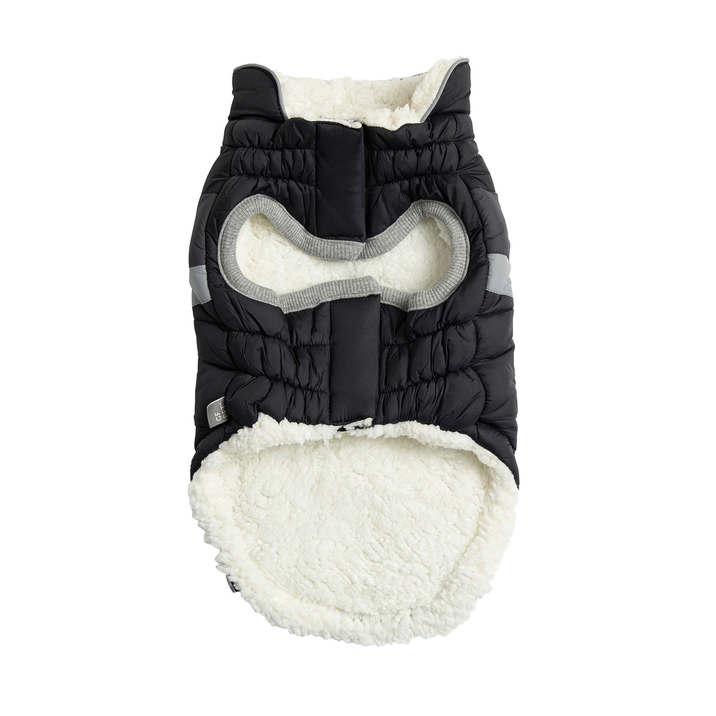 Black and white quilted dog coat on a white background