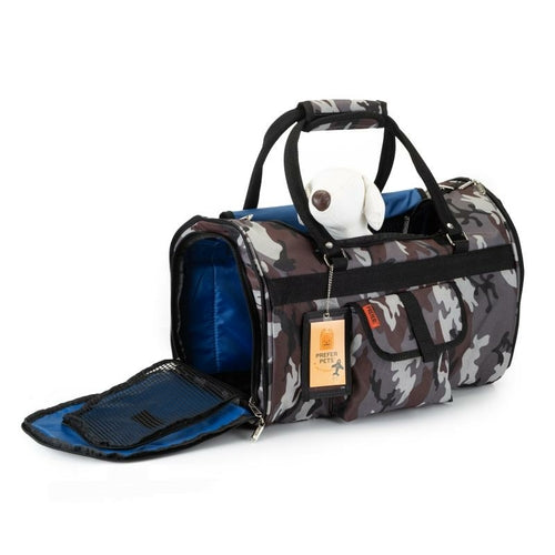 Camouflage pet carrier with a dog inside on a white background