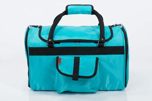 Turquoise duffel bag with black straps on a white background