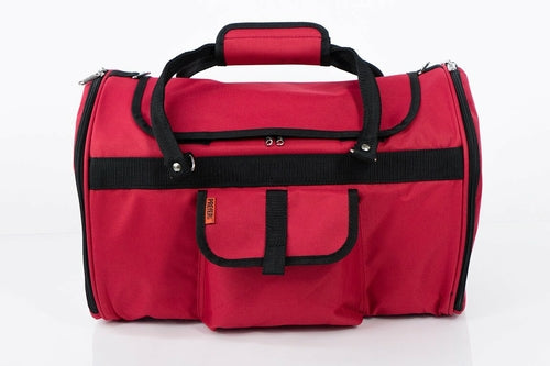 Red duffel bag with black straps on a white background