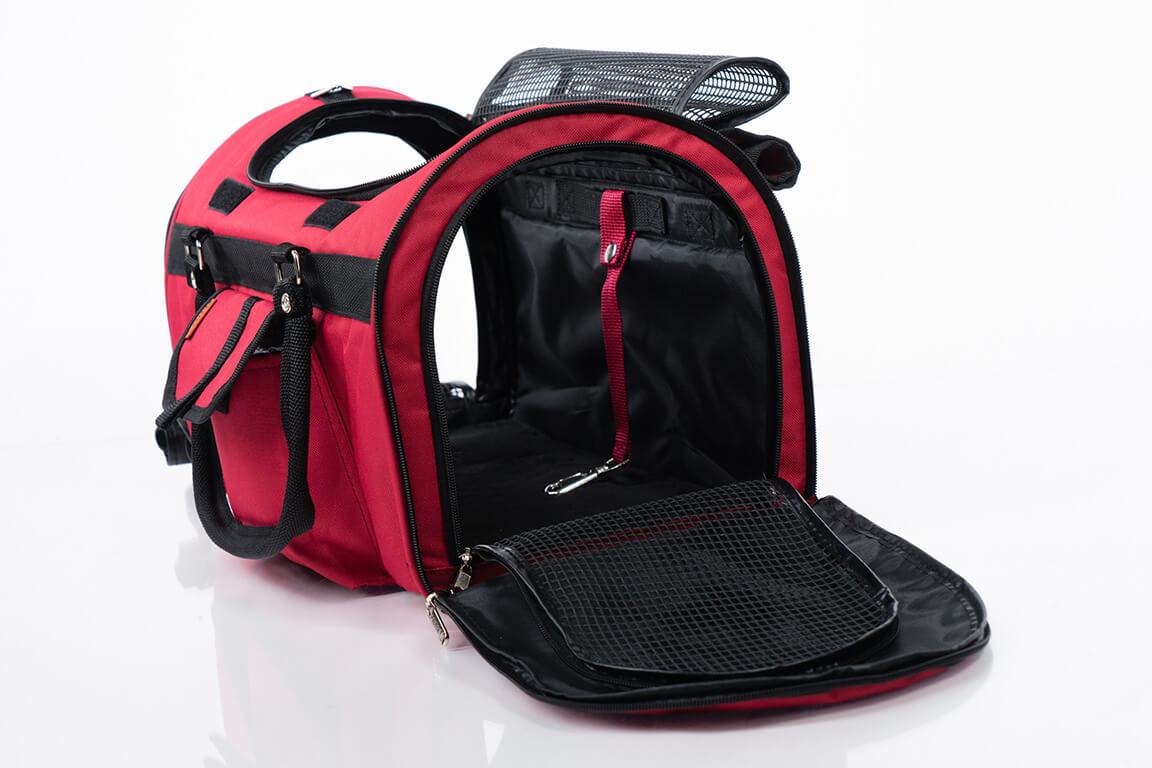 Red and black pet carrier on a white background