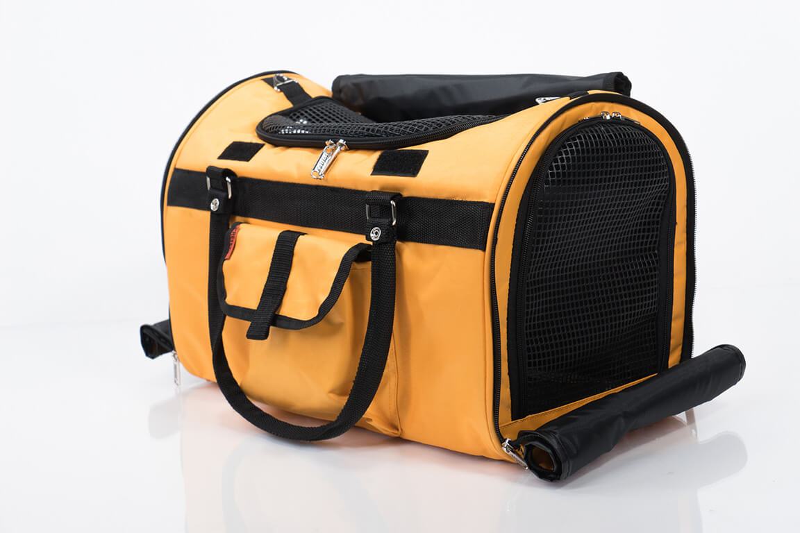 Yellow pet carrier with black accents on a white background