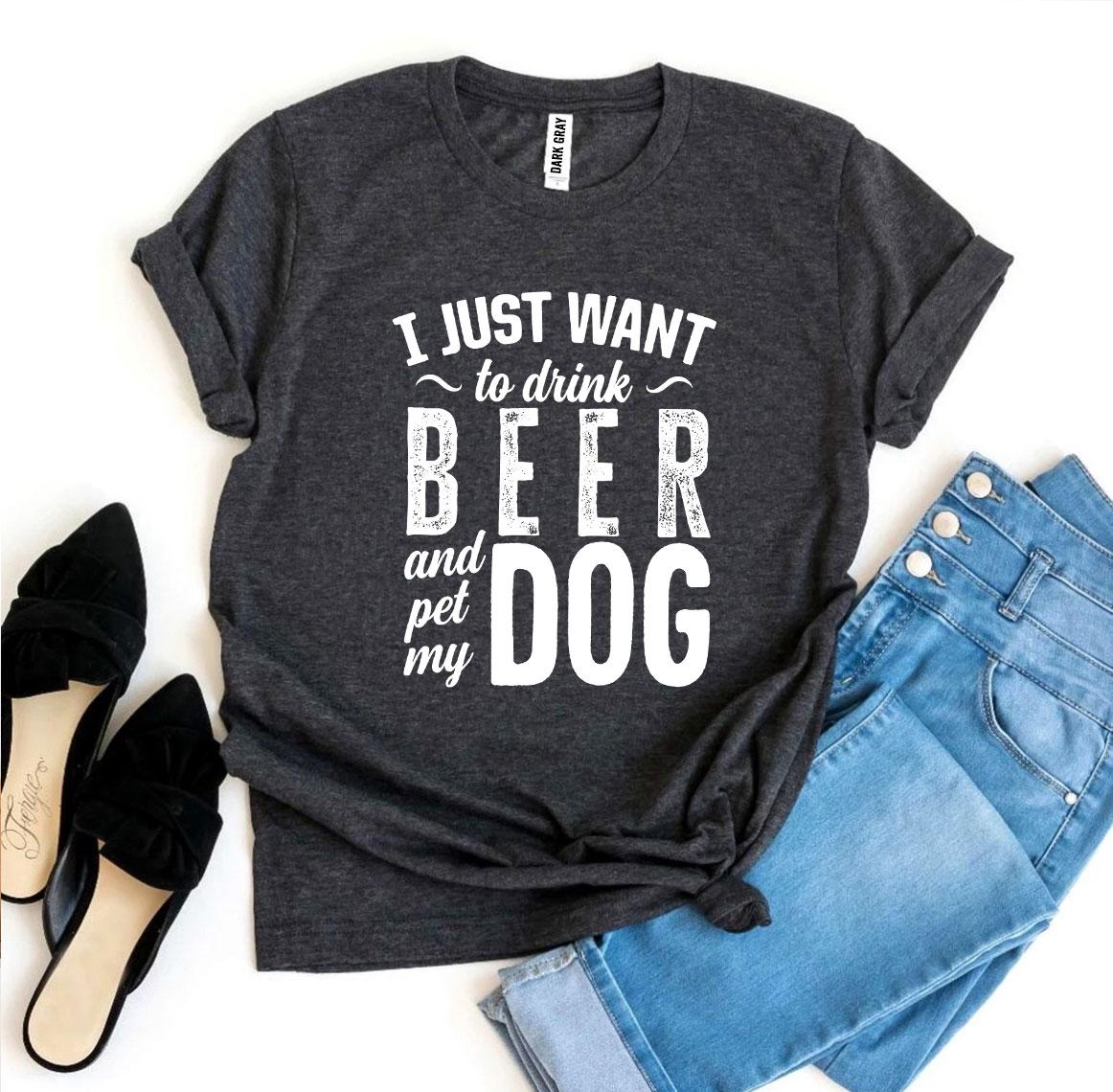 Dark gray t-shirt with 'I just want to drink beer and pet my dog' text, paired with jeans and shoes on a white background.