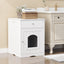White wooden pet door cabinet with a small dog peeking out, placed against a beige wall.
