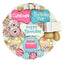 Dog birthday cookie platter with colorful treats on a white background