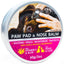 Paw pad and nose balm container with a dog and hand on a white background