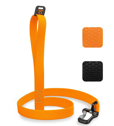 Orange dog leash with black clip and textured grip on a white background