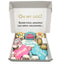 Box of dog birthday cookies with decorative text on a white background