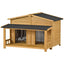Wooden pet house with a black roof on a white background