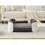 Gray pet bed in a living room setting with a sofa and rug.