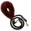 Black dog leash with a red fuzzy handle on a white background
