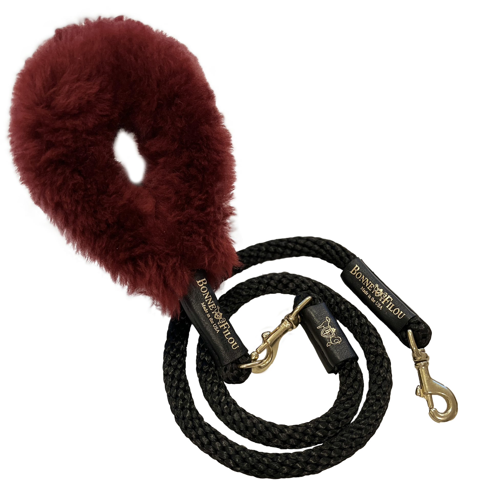 Black dog leash with a red fuzzy handle on a white background