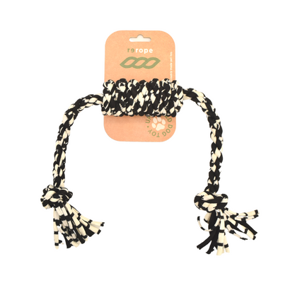 Black and white braided rope toy with tassels on a white background