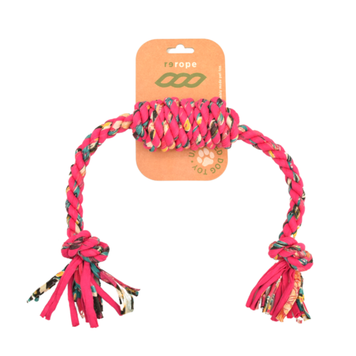 Pink braided rope toy with colorful tassels on a white background