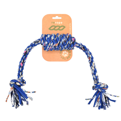 Dog rope toy with colorful tassels on a white background
