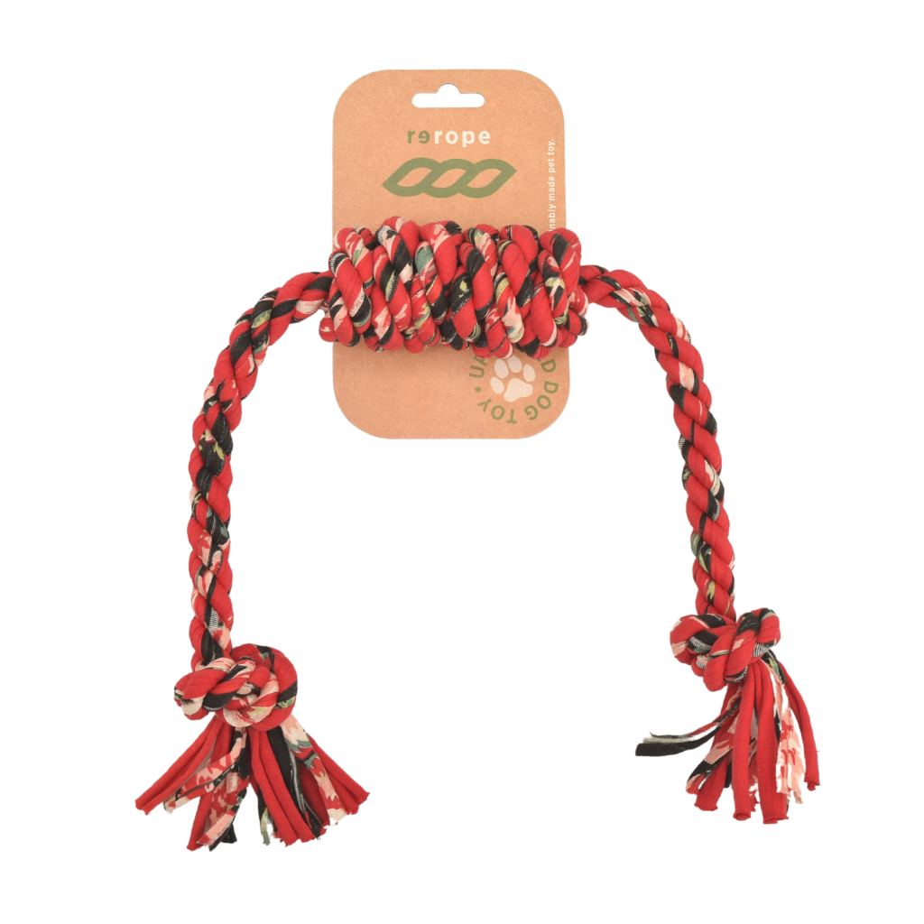 Red and black braided rope toy with a brand label on a white background