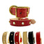 Red leather dog collar with gold accents on a white background