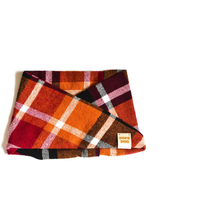 Plaid blanket with a visible brand label on a white background