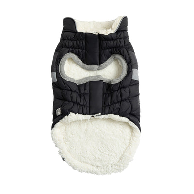 Black and white quilted dog coat on a white background