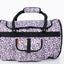 Patterned duffel bag with black handles and trim on a white background