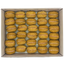 Box of yellow macarons with pink filling on a white background