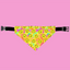 Dog bandana with smiley face pattern on a pink background