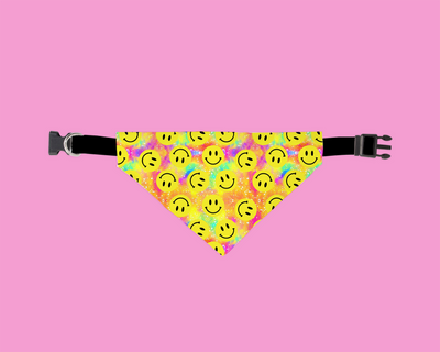 Dog bandana with smiley face pattern on a pink background