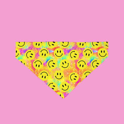 Neon smiley face patterned bandana on a pink background