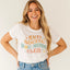 Woman wearing a white t-shirt with 'Anti Social Dog Moms Club' text on a plain background