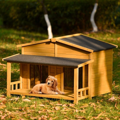 Wooden doghouse with a dog inside on a grassy outdoor setting