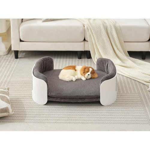 Pet bed with a dog inside in a living room setting