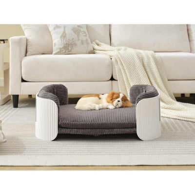 Dog lying on a elevated pet bed in a living room setting