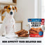 Dog sitting next to a plate of chicken jerky treats and a package of Beloved Chicken Jerky Dog Treats.