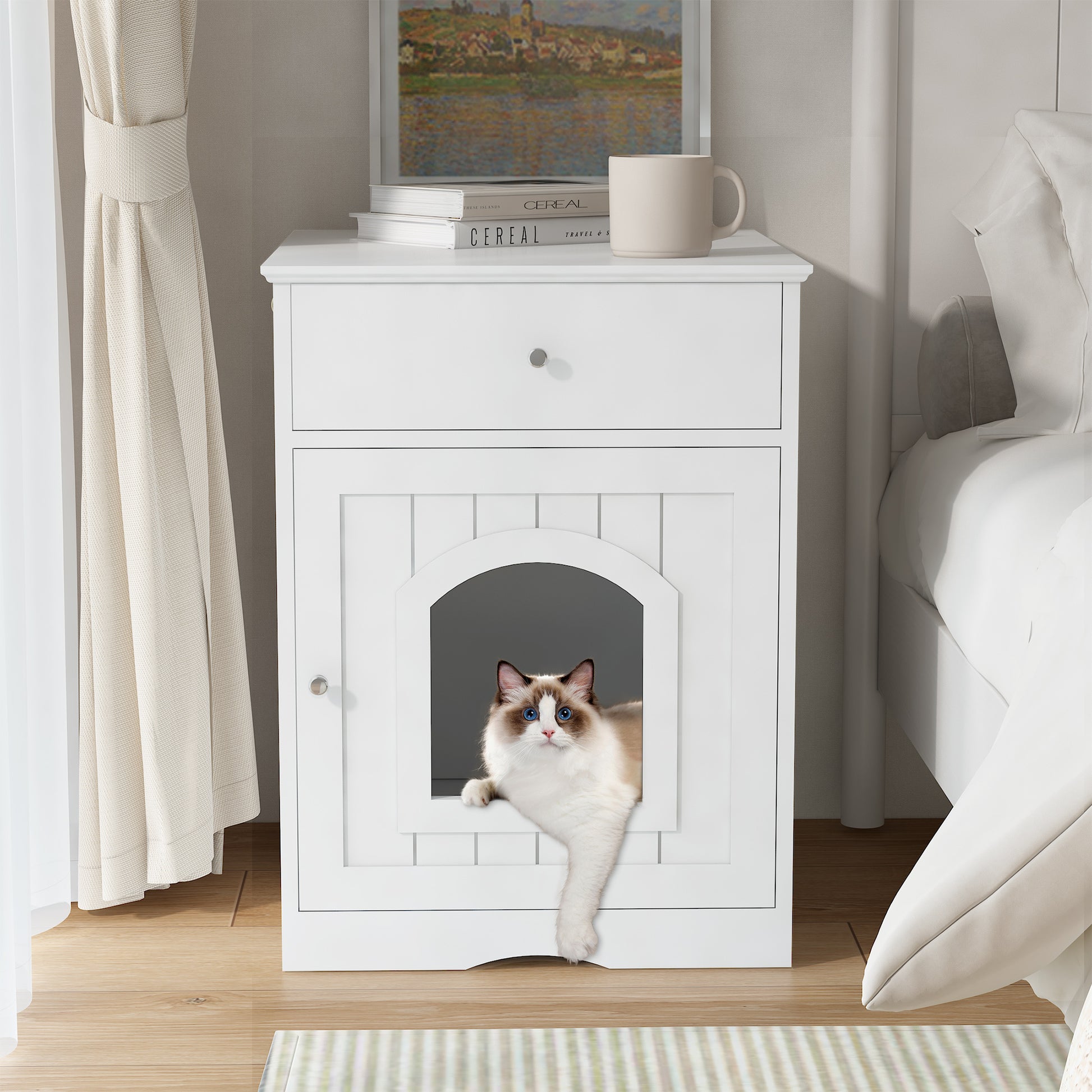 White wooden pet house with a cat peeking out, placed on a wooden floor in a room.