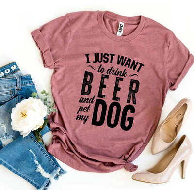 Mauve t-shirt with 'I just want to drink beer and pet my dog' text, paired with jeans and high heels on a white background.
