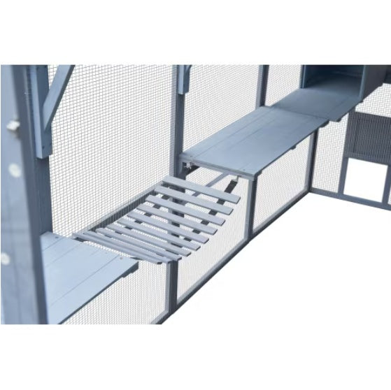 Metal staircase with a wire mesh railing on a white background