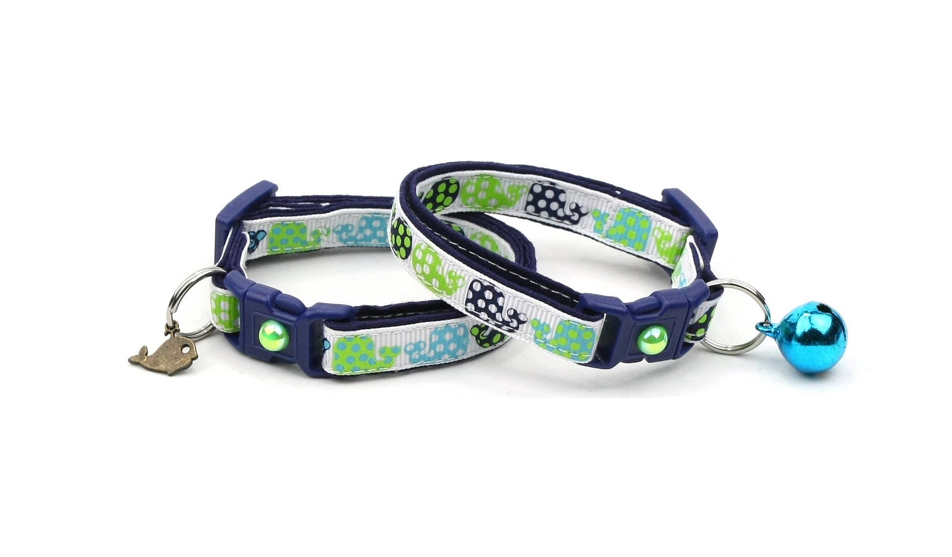 Two dog collars with green and blue patterns on a white background